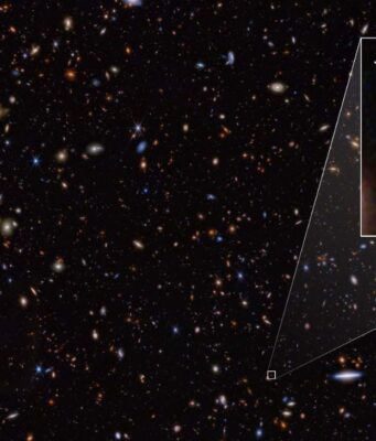 Il JWST sfida il modello standard: nuove prospettive sull’universo primordiale JADES-GS-z14-0 (mostrata nell'estrazione), è stata determinata a un redshift di 14,32 (+0,08/-0,20), il che la rende l'attuale detentrice del record per la galassia più distante conosciuta. Ciò corrisponde a un periodo inferiore a 300 milioni di anni dopo il big bang. Credito: NASA, ESA, CSA, STScI, B. Robertson (UC Santa Cruz), B. Johnson (CfA), S. Tacchella (Cambridge), P. Cargile (CfA).